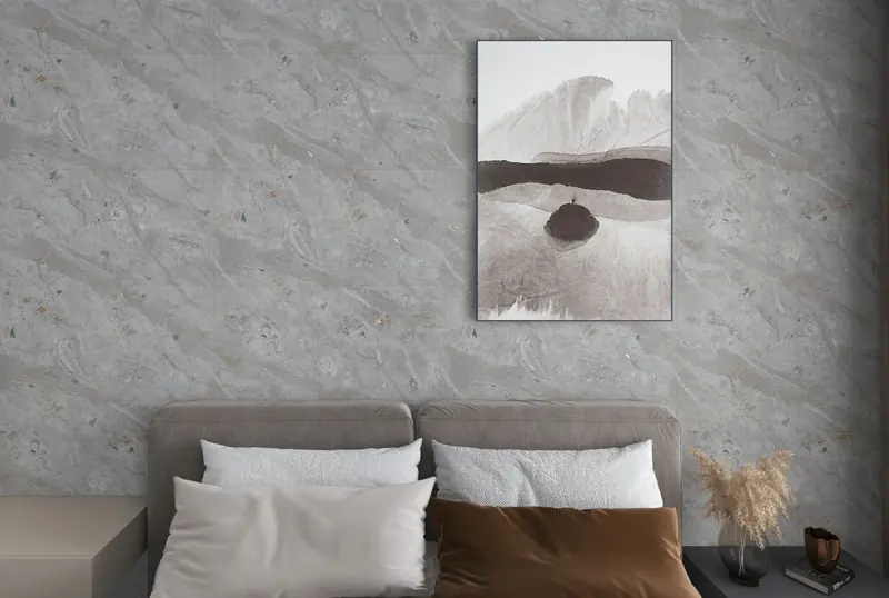 Bedroom with a grey stone-look wall behind the bed
